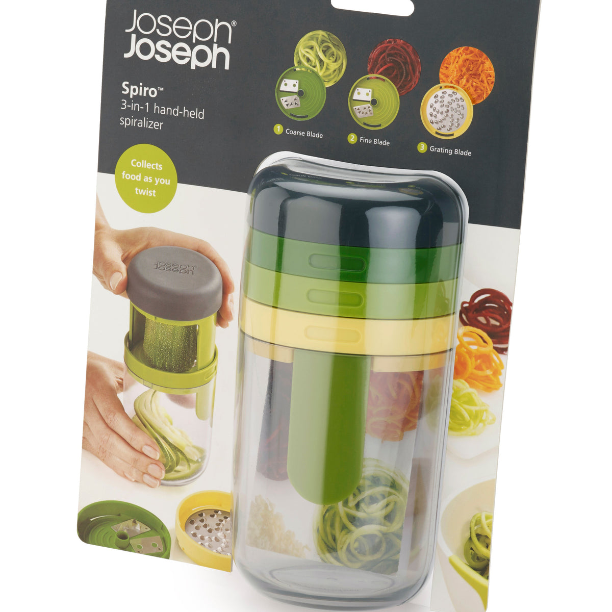 Joseph Joseph Spiro 3-in-1 hand-held spiralizer in its retail packaging, featuring a green and clear plastic body with a dark gray cap.