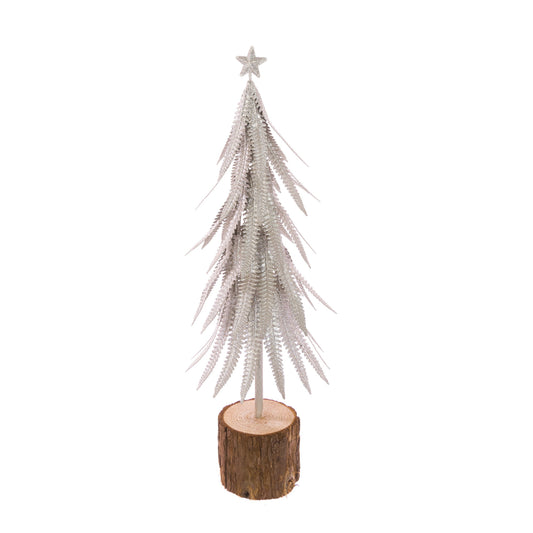 A miniature silver glitter Christmas tree with a star topper, mounted on a rustic wood slice base, set against a plain white background.