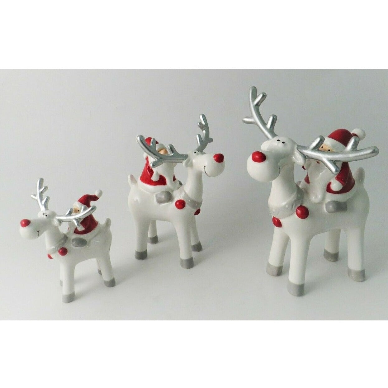 Ceramic Santa Riding Reindeer with Red Nose and Silver Antlers